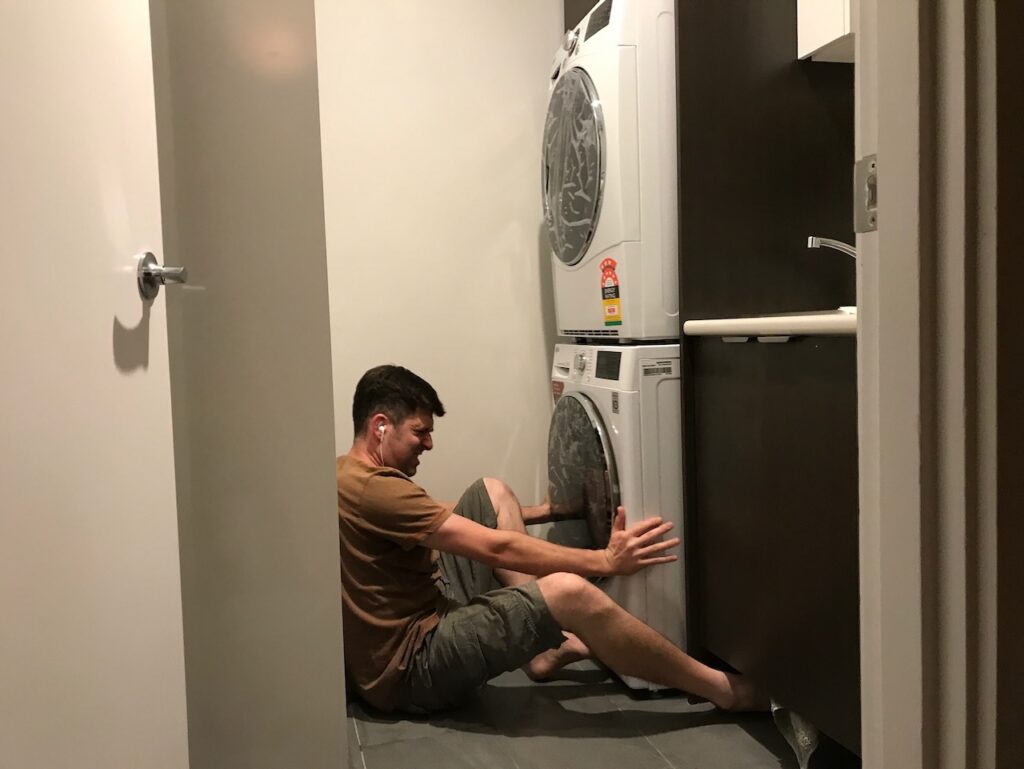 Demonstrating the stacked heat pump clothes dryer installation technique