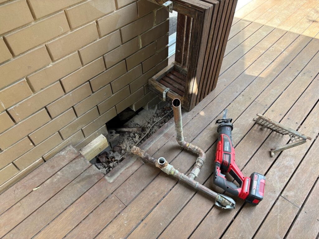 A red sawsall and the remnants of the fossil fuel economy