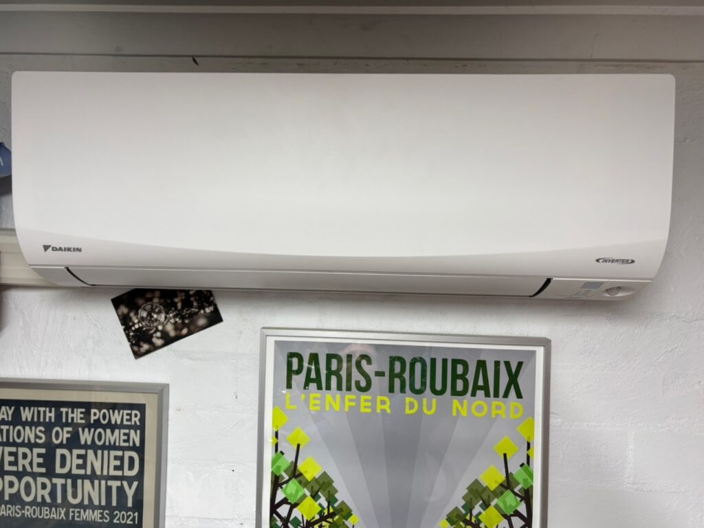 A Daikin Split System and Paris Roubaix Posters