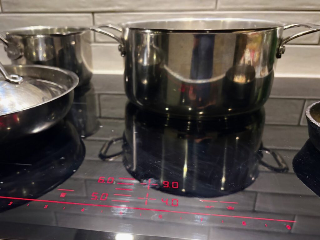 Induction cooktop with pots and pans