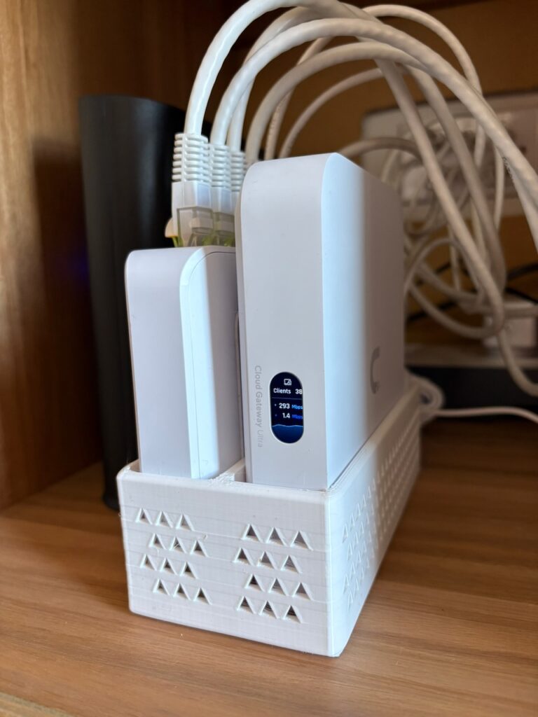 UniFi networking hardware in a 3D printed dock